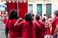 Devotees of Santa Barbara dressed in red during mass