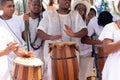 candomble members are playing percussion instruments during the party for yemanja