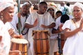 candomble members are playing percussion instruments during the party for yemanja