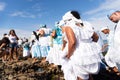 Candomble members are seen standing on the rocks of Rio Vermelho beach to offer gifts to Yemanja