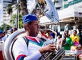 Musician playing Tuba during the pre-carnival Fuzue parade