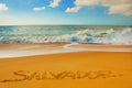 SALVADOR, BAHIA, BRAZIL: Inscription on the sand city of Salvador, drawing on the beach