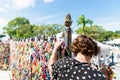 Faithful pray in front of the grid of the church of Senhor do Bonfim on the traditional first Friday of 2023