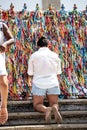 Faithful pray in front of the grid of the church of Senhor do Bonfim on the traditional first Friday of 2023