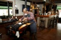 Barber working in barbershop