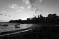 Beautiful black and white sunset with dramatic clouds on the Rio Vermelho beach in Salvador, Bahia