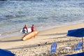 Surfer entering the sea from Farol da Barra beach. Salvador, Bahia, Brazil Royalty Free Stock Photo