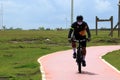 Salvador Bahia Brazil. 12/04/2020. Lone cyclist walking with a mask of protection against the coronavirus on the edge of Salvador