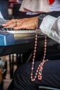 Closed portrait of a hand playing the piano in homage to corpus christ