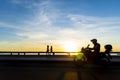 Silhouette of people running, walking, playing at sunset. Praia da Ribeira, Salvador, Bahia, Brazil