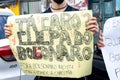 Brazilians protest with banners and posters with words against the government of President Jair Bolsonaro