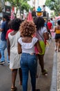 Demonstrators walk with posters, banners and flags during the Crespo Empowerment March in Salvador, Bahia