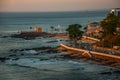 SALVADOR, BRAZIL: Colonial Fort Santa Maria in Barra Salvador Brazil built on tropical beach with palm trees