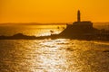 SALVADOR, BRAZIL: Portrait of the Farol da Barra Salvador Brazil lighthouse. Beautiful landscape with verm at sunset