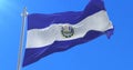 Salvadoran flag waving at wind with blue sky, loop
