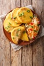 Salvadoran pupusa served with curtido closeup. Vertical top view Royalty Free Stock Photo