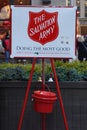 Salvation Army sign and red kettle for collections in midtown Manhattan Royalty Free Stock Photo