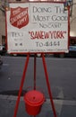 Salvation Army sign and red kettle for collections in midtown Manhattan Royalty Free Stock Photo