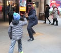 Salvation Army soldier performs for collections in midtown Manhattan. Royalty Free Stock Photo