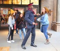 Salvation Army soldier performs for collections in midtown Manhattan. Royalty Free Stock Photo