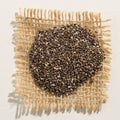 Chia Seed. Close up of grains over burlap.