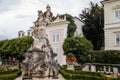 Salzburg, Austria, 28 August 2021: Famous Mirabell gardens near palace, geometrically arranged park, Baroque stone statue of the Royalty Free Stock Photo