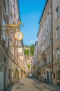 Salzburg, Austria - August 13, 2018: Getreidegasse street - famous shopping street in Salzburg
