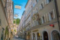 Salzburg, Austria - August 13, 2018: Getreidegasse street - famous shopping street in Salzburg