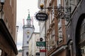 Salzburg, Austria, 28 August 2021: Grain Lane or Getreidegasse famous shopping narrow street in historic Altstadt, wrought iron