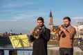 Two trompet players performing on the Love Lock Bridge in Salzburg, Austria