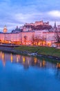 Evening twilight view of Salzburg across Salzach river in Austria Royalty Free Stock Photo