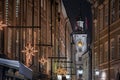 Salzburg, Austria - Illuminated clock tower of the former Old Town Hall at Christmas decorated Grain Lane Getreidegasse Royalty Free Stock Photo