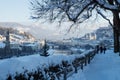 Salzburg, Austria - January 1 2015: Walkers on a snowpath on Moenchsberg with view on Salzburg old city Royalty Free Stock Photo