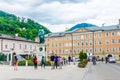 SALZBURG, AUSTRIA, JULY 3, 2016: People are strolling over the Mozartplatz square in the historical part of the Austrian Royalty Free Stock Photo