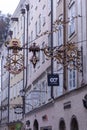 Famous historical street Getreidegasse with multiple advertising signs. Salzburg old town was listed as a UNESCO World Heritage Royalty Free Stock Photo