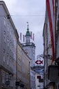 Famous historical street Getreidegasse with multiple advertising signs. Salzburg old town was listed as a UNESCO World Heritage Royalty Free Stock Photo