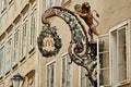 Salzburg, Austria - September 11, 2018: original McDonalds advertising sign close up view at amous historical street Getreidegasse