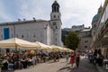 People enjoy the Salzburg town fair on a beautiful summer day