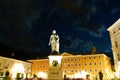 Statue Mozart in Square at night illuminated and golden in colo