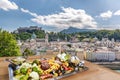 Salzburg city with gastronomic experience of typical Austrian food against downtown in Austria