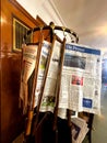 nterior view a stand of newspaper sticks at CafÃ© Tomaselli. Newspaper sticks