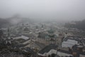 Salzburg town. Top view to the Residenzplatz on the fog.