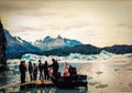 Tourists at a boat in Torres del Paine, Chile. Grey Glacier