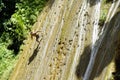 Samana, Dominican Republic, circa September 2022 - Locals running and jumping on Rio los Cocos Waterfall