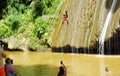 Samana, Dominican Republic, circa September 2022 - Locals running and jumping on Rio los Cocos Waterfall