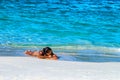 SAMANA, DOMINICAN REPUBLIC - OCTOBER 31, 2015: Unidentified tanned woman sunbathes in Samana, Dominican Republic