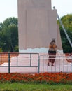 Samara, Chapaevsk, Russia-September. 12.2017: female worker paints the wall of the monument