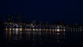 Samara city, Russia. May 2, 2021. Night view from Volga River on Ladja boat monument and beautiful Orthodox Church. One
