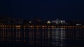 Samara city, Russia. May 2, 2021. Night view from Volga River on Ladja boat monument and beautiful Orthodox Church. One