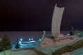 Samara. Night view of the Volga and the stele `Rook`. Stela Rook - a huge, white, reinforced concrete monument in the form of a fl Royalty Free Stock Photo